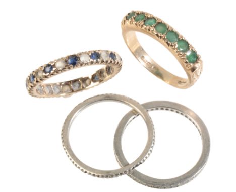 A DIAMOND FULL ETERNITY RING set in unmarked white metal, ring size N-O; together with three other rings (4)