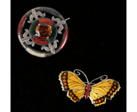 A SCOTTISH CAIRNGORM AND AGATE BROOCH the stones set in chased unmarked white metal, fastened with an overshot pin and "C"-cl