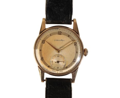 LONGINES: A GENTLEMAN'S 9CT GOLD WRISTWATCH with manual wind movement, the silver dial with silver subsidiary dial, gold bato