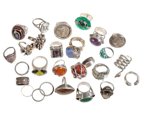 A COLLECTION OF SILVER AND WHITE METAL RINGS including a silver ring designed by "Shirley Frost" (a lot)