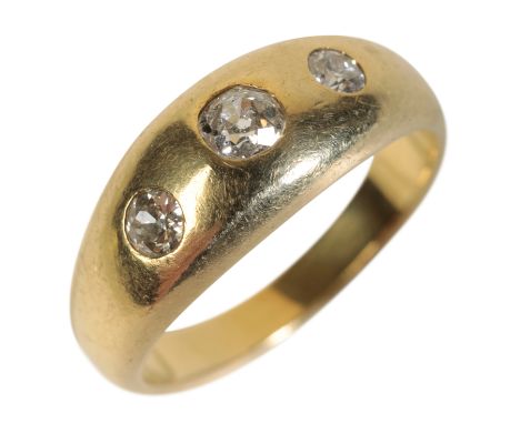 A THREE STONE GYPSY STYLE RING the three graduated old-cut diamonds, set in an 18ct yellow gold band, ring size T