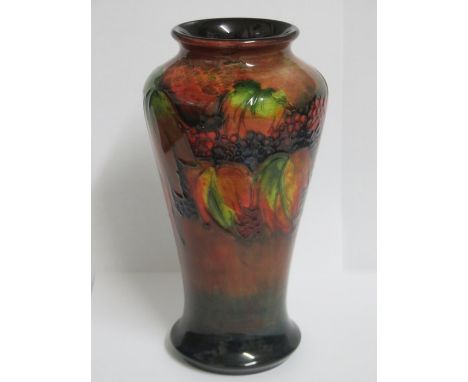 MOORCROFT FLAMBE LEAF AND BERRY PATTERN TUBE LINED CERAMIC VASE BY WILLIAM MOORCROFT, CIRCA 1930s, APPROXIMATELY 18cm HIGH