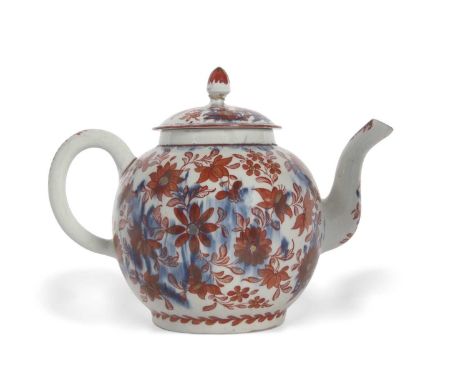 An unusual Lowestoft porcelain large teapot or punch pot, circa 1780, the blue ground decorated in red overglazed enamel with