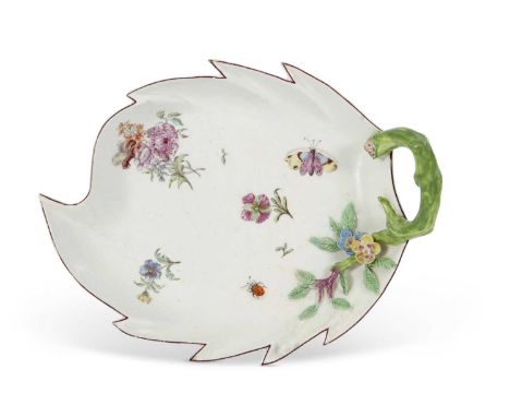 A Chelsea porcelain leaf dish with shaped rim and green stalk handle decorated in Meissen style with flowers and insects, red