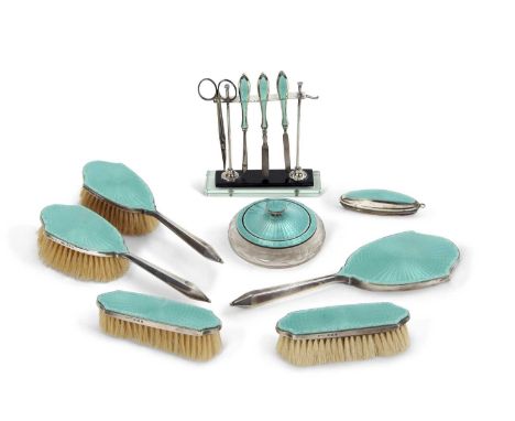 An Art Deco silver and guilloche enamel vanity set, each with a turquoise enamel decoration comprising glass jar and lid, mir