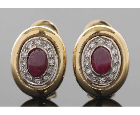 A pair of ruby and diamond earrings, the central collet mounted oval ruby cabochon surrounded by single cut diamonds, total w