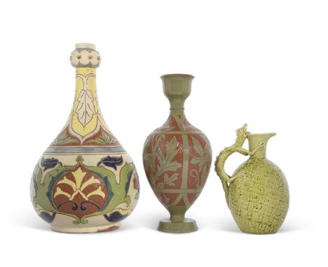 A group of Art Pottery wares including a Salopian vase in the Rhodian pattern, a small Burmantofts ewer with dragon type hand