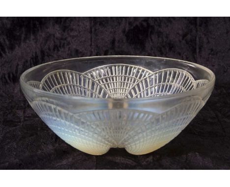 A 1930's Lalique bowl in the Coquilles pattern with shell moulded opalescent feet, 21cm diameter, etched mark R Lalique, Fran