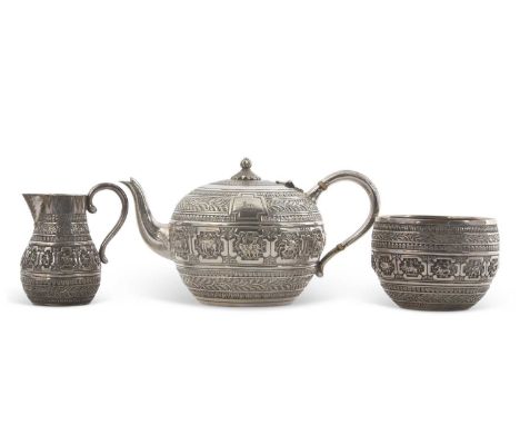 A cased Victorian three piece silver breakfast service, comprising teapot, milk jug and sugar basin of compressed baluster sh