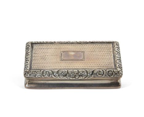 A George IV silver snuff box of oblong form with all over engine turning, the hinge applied with a floral and scroll edge and