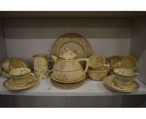 Clarice Cliff at Wilkinson Ltd, a floral decorated tea service.