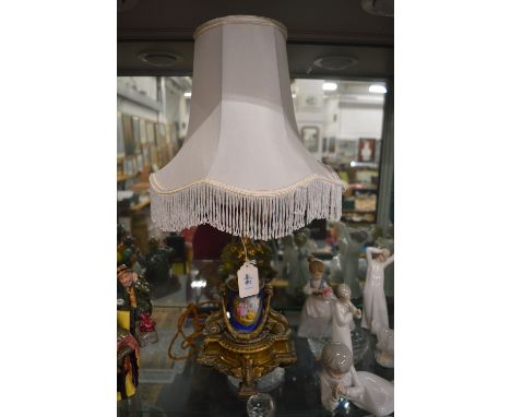 A good ormolu and porcelain lamp.