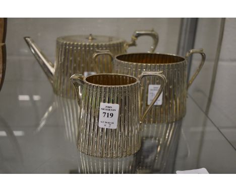 A plated three piece tea service.