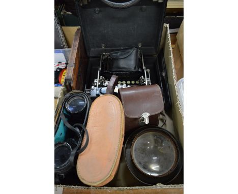 An early typewriter, binoculars and other items.
