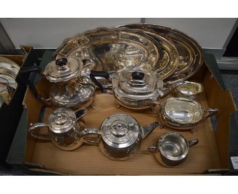 A plated four piece tea service, three piece tea service and three oval trays.