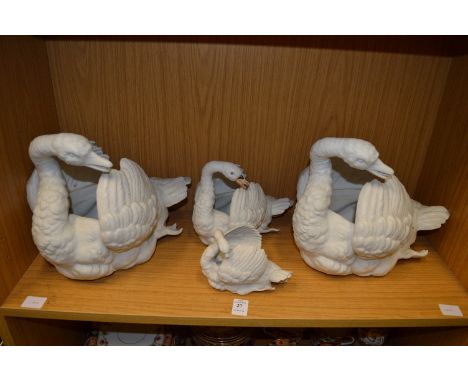 A set of four Continental Bisque porcelain swan shaped jardinieres.