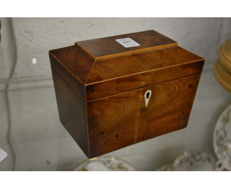 A 19th century mahogany sarcophagus shaped tea caddy.