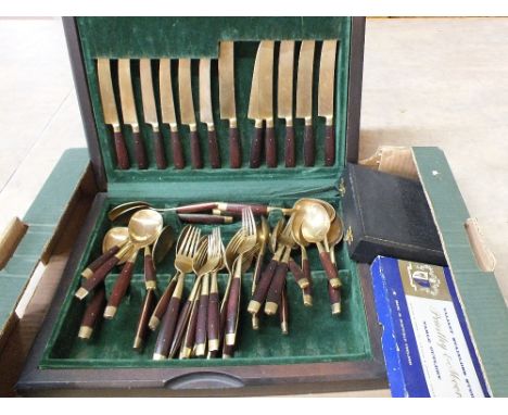 A canteen and boxed cutlery plus a brass three branch light fitting