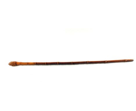 A walking stick (with measure horse)