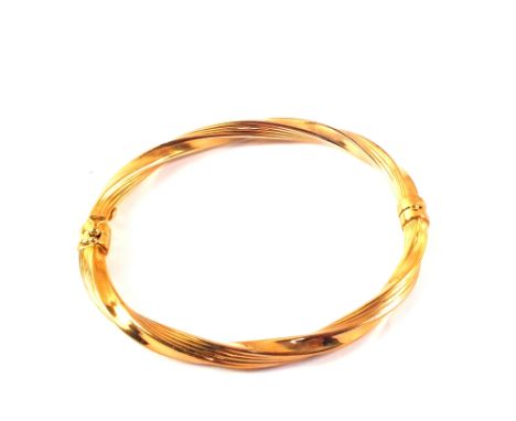 A 9ct gold bangle