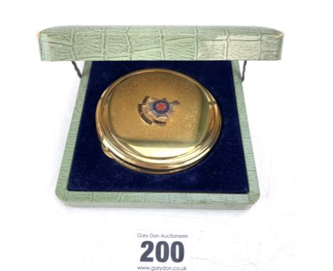 Brass compact with emblem of The Royal Sussex Regt., 3.25" diameter in original box
