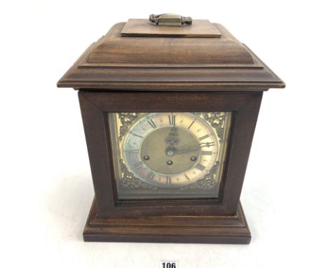 German Junghaus wooden 3- hole mantle clock with handle and pendulum. 12" w x 8" d x 14.5" high