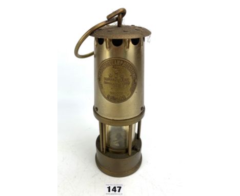 Miners lamp marked 'The Protector Lamp &amp; Lighting Co. Ltd, Eccles, Type 6, M &amp; Q Safety Lamps' 10" high