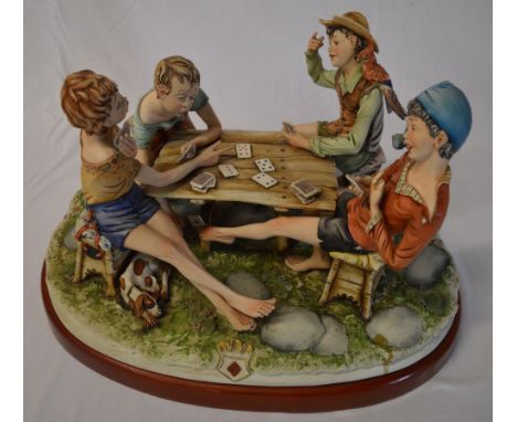 Large Capodimonte figure of 4 boys playing cards around a table