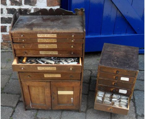 Two clock makers cabinets containing assorted tools and springs etc