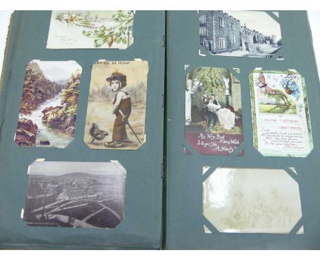 An album of vintage postcards, to include portrait and architectural examples