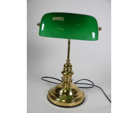 An early 20th century style banker's desk lamp, having  a green glass shade on brass base, height 36cm