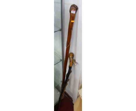 A wooden walking stick, length 135cm; together with two others (3)