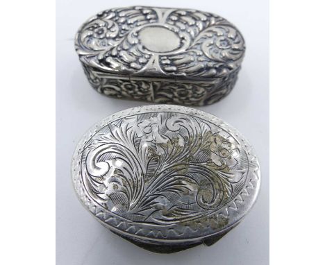 A continental white metal snuff box of hinged oval form decorated with stylised flowers, stamped 800 to the interior, width 4