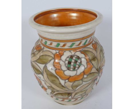 Charlotte Rhead for Crown Ducal Pottery, a cream glazed pottery vase of ribbed form, tubeline decorated with flowers, height 