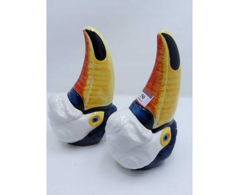 A pair of novelty ceramic wall pockets, in the form of toucan heads, length 23cm