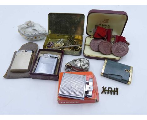 A collection of miscellaneous items to include plated metal vesta case in the form of an elephant's head, cigarette lighters,