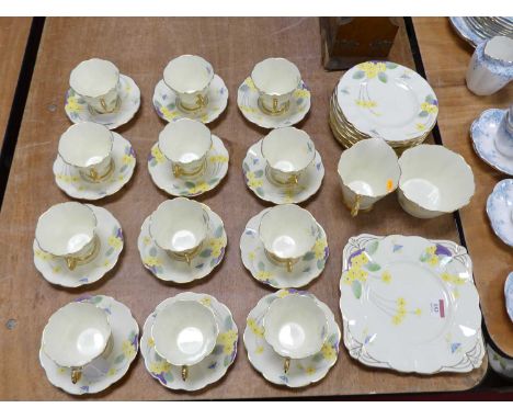 A Scottish Art Deco Gainsborough twelve place tea service, enamel decorated with flowers