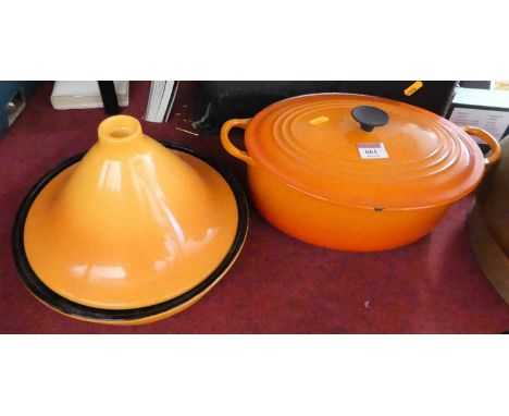 A Le Creuset orange enamel cooking pot, together with a similar tagine