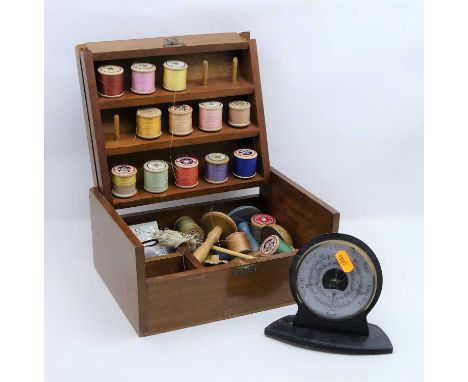 A 20th century sewing box and contents; together with a desk thermometer/barometer 