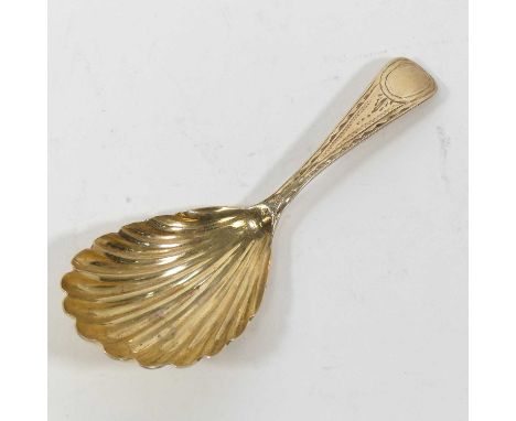 A George III silver gilt caddy spoon, having a shell shaped bowl, and bright cut engraved terminal, Robert Rutland, London 18