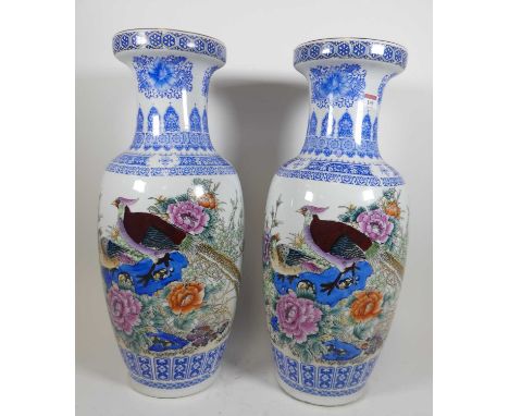 A pair of 20th century Chinese porcelain vases, of rouleau form, each enamel decorated with birds, height 61cm