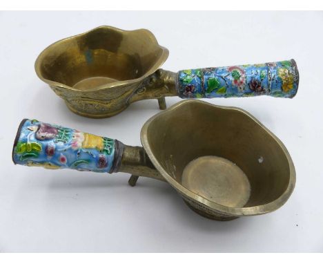 A graduated pair of Chinese brass ladles, each having an enamel decorated handle, longest length 17.5cm 