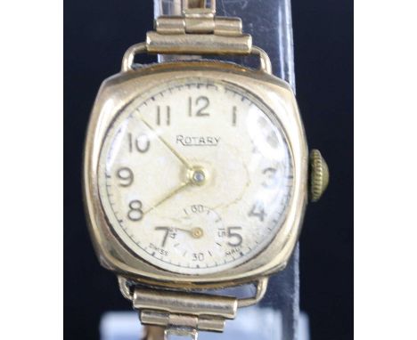 A 9ct yellow gold manual wind Rotary watch, having a round cream Arabic dial and sub-dial at 6, attached to a sprung link bra