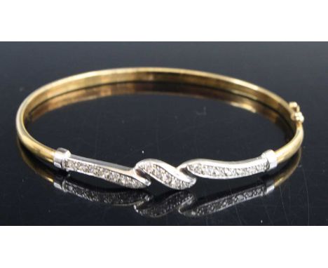 A 9ct gold and CZ set hinge bangle as retailed by H Samuel, with box, 4.1g, dia. 6.2cm