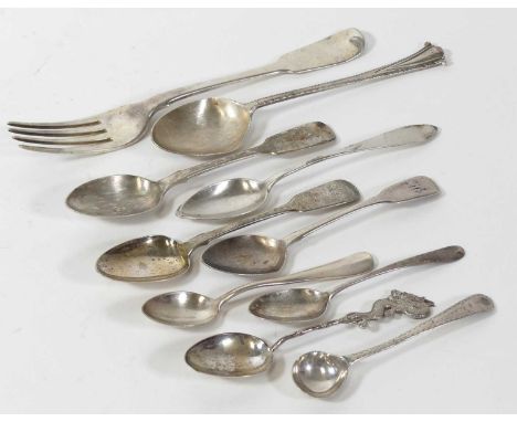 A George III silver table fork, in the fiddle pattern, London 1818, together with various silver and white metal flatware, gr