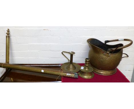 A Cromwellian style brass candlestick; another; a brass curtain pole; stair rods