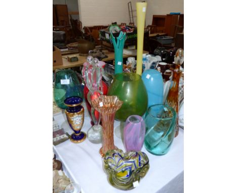 A tall amber overlaid glass decanter; other coloured glassware