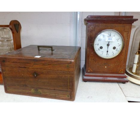 An Edwardian mahogany chiming mantel clock with painted inlay effect; a 19th century rosewood workbox; a 19th century needlew