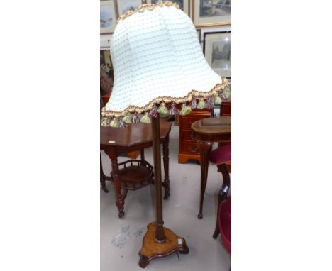 A walnut standard lamp and shade