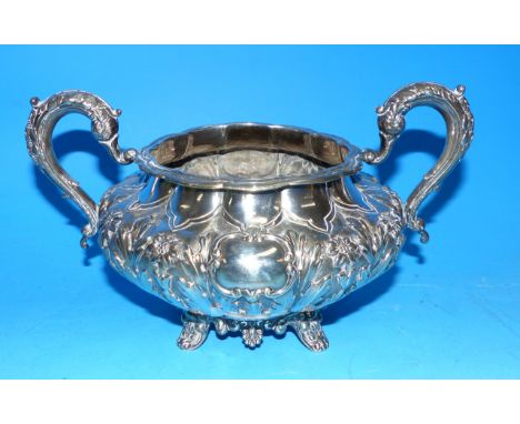 A 19th century Irish silver sugar basin of compressed circular form, embossed with flowers and leaves, maker R.S. Dublin, 183